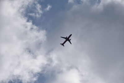 Low angle view of airplane in sky