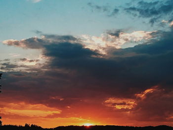 Low angle view of dramatic sky during sunset
