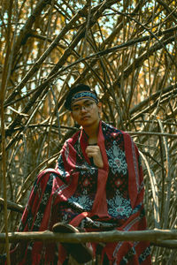 Portrait of young man in forest