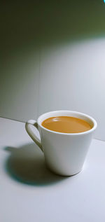 Close-up of coffee cup on table