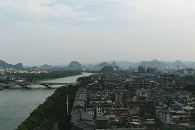 High angle view of townscape by sea