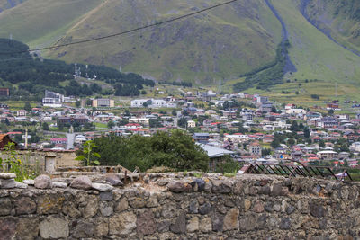 City view of stepantsminda, georgia. old houses and mountain view.