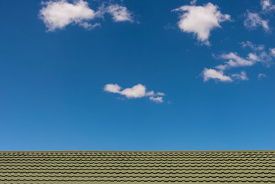 High section of built structure against blue sky