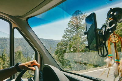 Man seen through car window