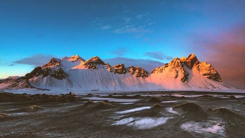 Scenic view of snowcapped mountains against sky