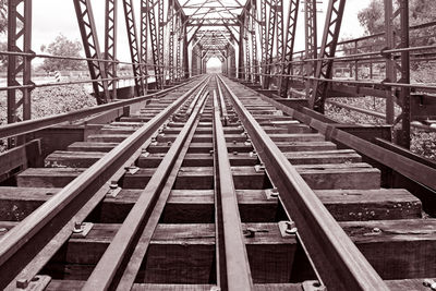Railroad tracks along bridge