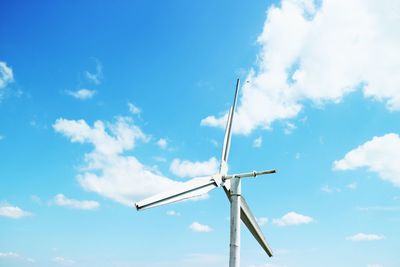 Low angle view of wind turbine against sky