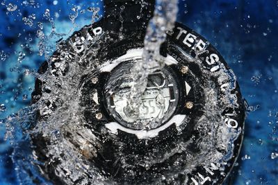 High angle view of watch in water