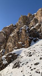 Scenic view of snowcapped mountains against clear blue sky in krasnoyarsk 