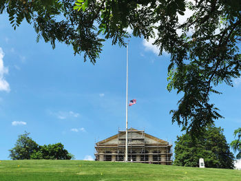 Low angle view of flag against sky