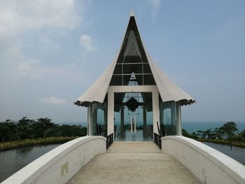 Gazebo by building against sky