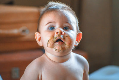 Close-up toddler boy with dirt on face