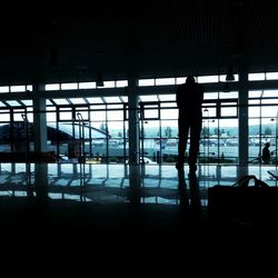 Silhouette people standing at airport