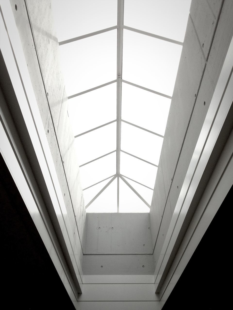 indoors, architecture, built structure, ceiling, window, low angle view, glass - material, railing, transparent, modern, directly below, skylight, geometric shape, building, pattern, day, no people, glass, wall, wall - building feature