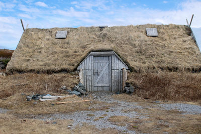 House on field against sky