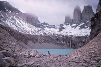 Scenic view of lake amidst snowcapped mountains