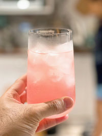 Close-up of hand holding drink