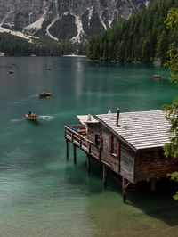 High angle view of stilt house by lake