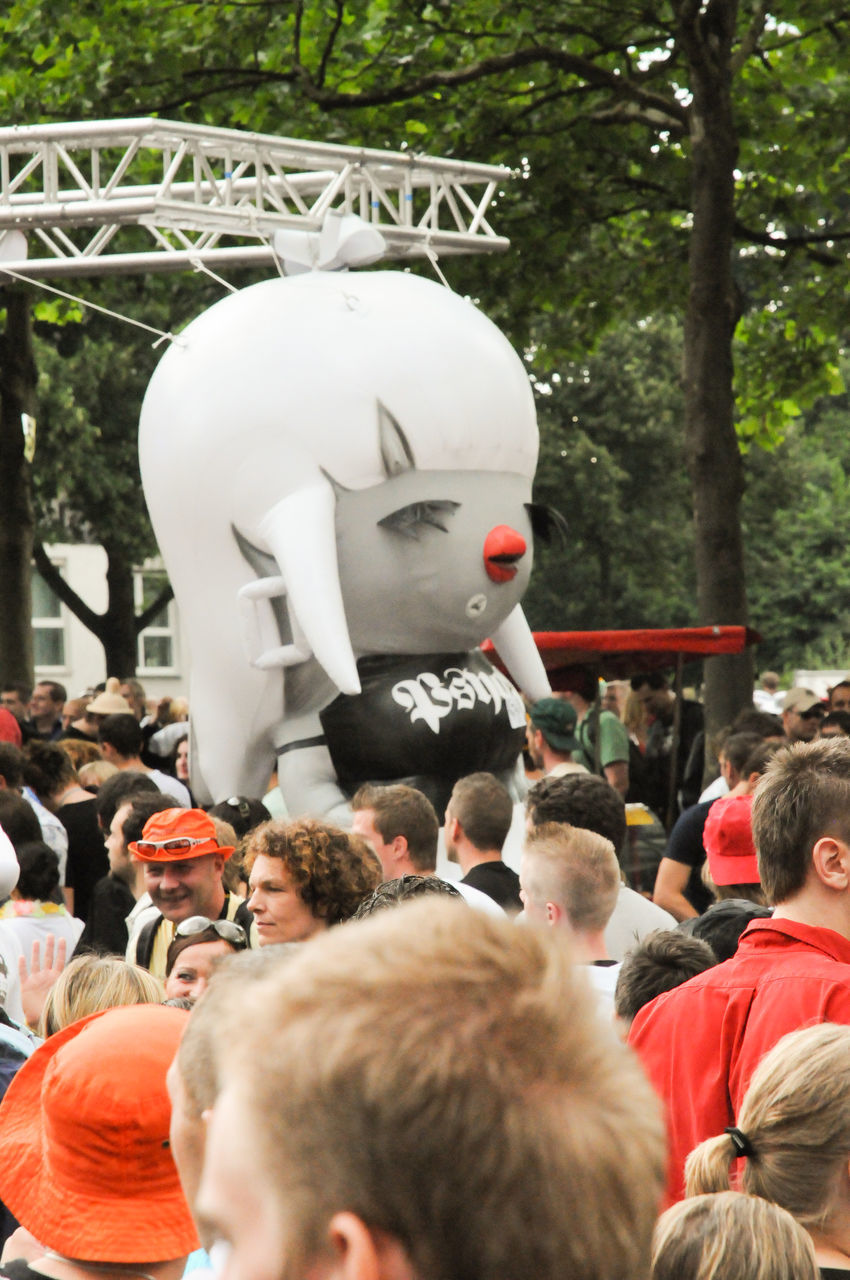 REAR VIEW OF PEOPLE IN STREET