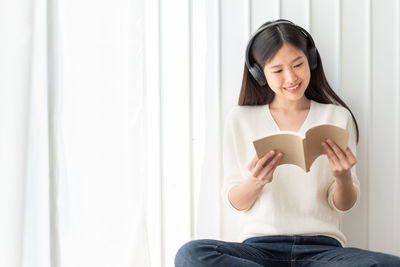 Young woman using mobile phone