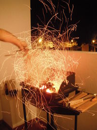 Close-up of illuminated fireworks against sky at night