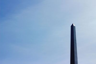 Low angle view of built structure against blue sky