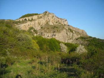 Low angle view of mountain against clear sky