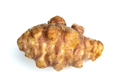 Close-up of roasted over white background