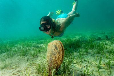 Man swimming in sea