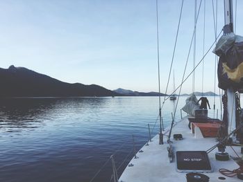 Boat sailing in sea against sky