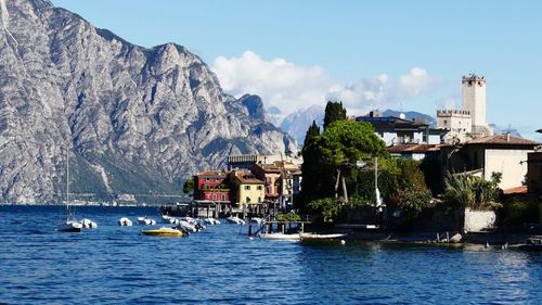 Scenic view of sea and mountains against sky