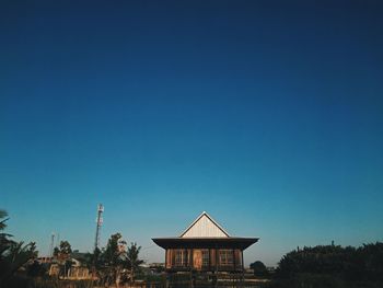 Low angle view of building against blue sky