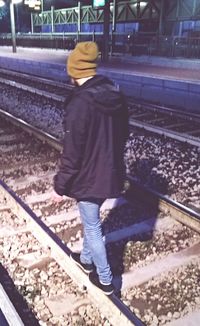 People standing on railroad track