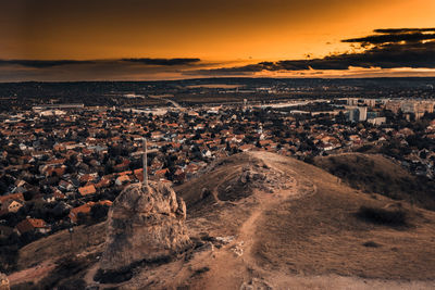 Aerial view of townscape against sky during sunset