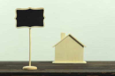 Close-up of toy on table against wall