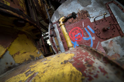 Low angle view of graffiti on abandoned building