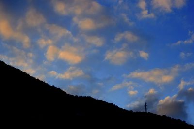 Low angle view of silhouette mountain against sky