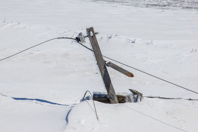 High angle view of snow covered land on field