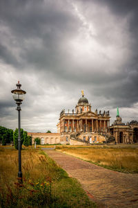 Low angle view of building against cloudy sky