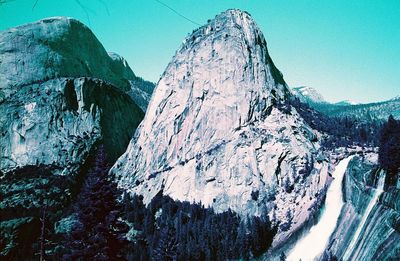 Panoramic view of snowcapped mountains against sky