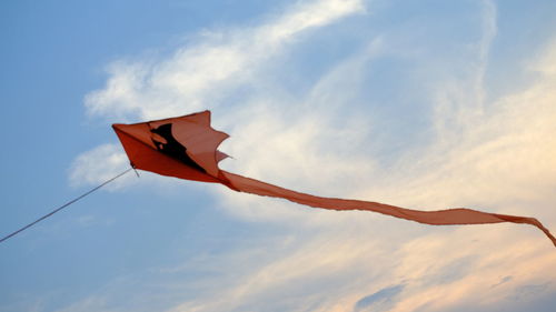 Low angle view of flag against sky