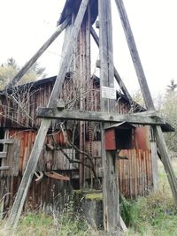 Low angle view of abandoned building against sky