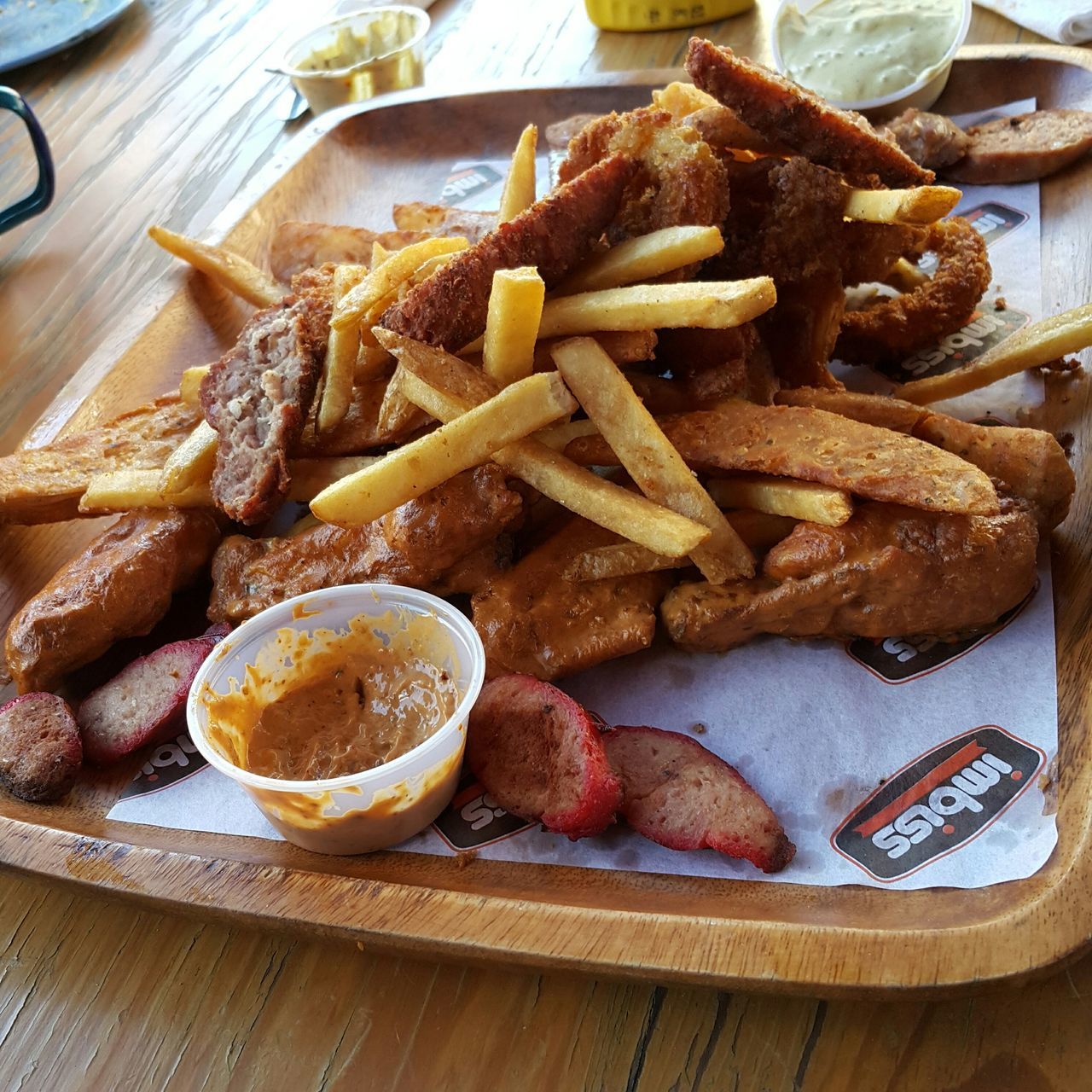 food and drink, food, freshness, indoors, ready-to-eat, plate, table, still life, unhealthy eating, bread, serving size, indulgence, high angle view, meat, meal, close-up, sauce, sweet food, french fries