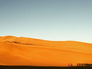 Scenic view of desert against clear sky
