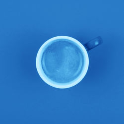 Directly above shot of coffee against blue background