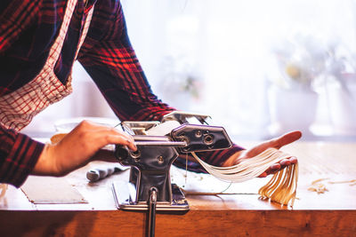 Close-up of man working on table