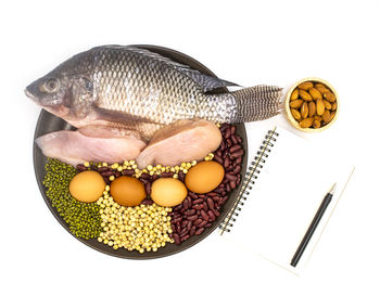 High angle view of eggs in plate