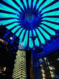 Low angle view of illuminated modern building in city