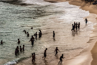 Large group of people on paciencia beach in the rio vermelho neighborhood of salvador, brazil. 