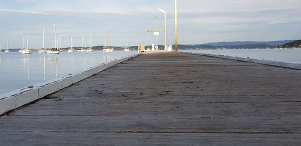 Pier over sea against sky